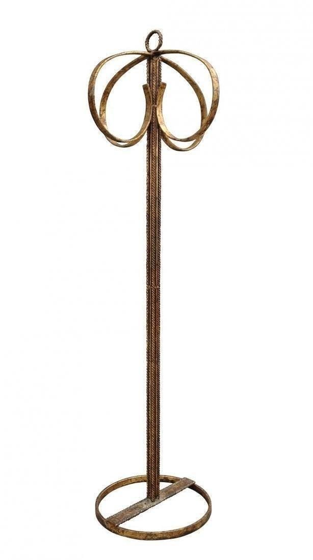Gold Gilded Wrought Iron Stand: Beautiful wrought iron stand fully gilded in gold, the piece is substantial and size and a delicate in appearance, the combination of flat and twisted metal works very well and the gold leaf is the ac