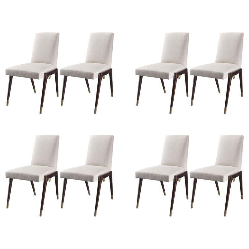 Set of 8 Sling Side Chairs by Thomas Pheasant for Baker: Like a sling, the mahogany base supports the finely tailored, crisp upholstery held together with artful brass dowels. The epitome of comfort and design, this chair will make heads turn.The chairs are