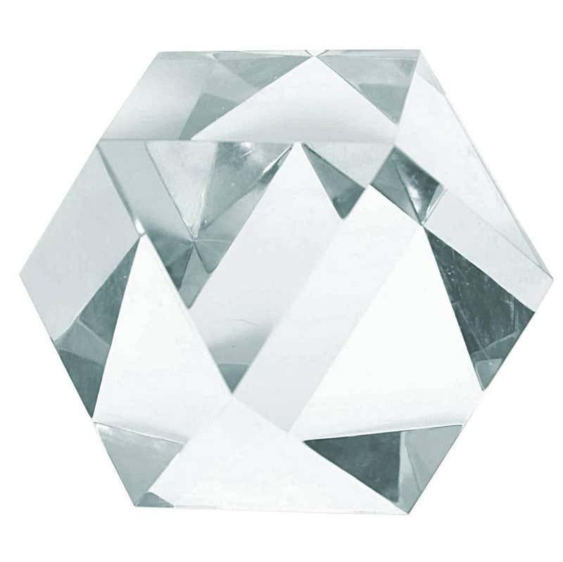 Large Faceted Lucite Sculpture: The piece is beautifully crafted, the faceted cuts makes this piece shine like a diamond when the light hits it, the piece is also unusually large which is wonderful to be used as a paperweight or sta