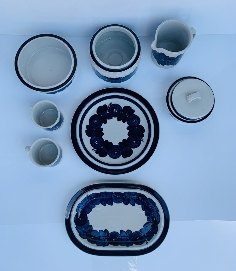 8 Hand Painted Serving Dishes by Ulla Procope, Arabia: Set of 8 Anemone serving dishes hand-made and hand-painted by Ulla Procope for Arabia Finland.The set consists of one large round platter, one large oval platter, 2 coffee mugs, one beer pitcher, 2 se