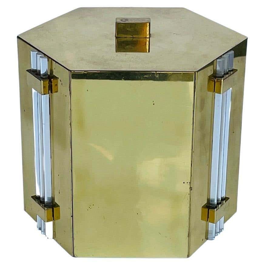 Solid Brass & Lucite Ice Bucket, Tommi Parzinger Style: Beautiful ice bucket made in Italy in solid brass and Lucite accents in the style of Tommi Parzinger.The piece has a hexagonal shape and it presents real well.Measurements:9 inches wide x 8.50 inches