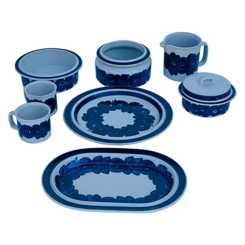 8 Hand Painted Serving Dishes by Ulla Procope, Arabia: Set of 8 Anemone serving dishes hand-made and hand-painted by Ulla Procope for Arabia Finland.The set consists of one large round platter, one large oval platter, 2 coffee mugs, one beer pitcher, 2 se