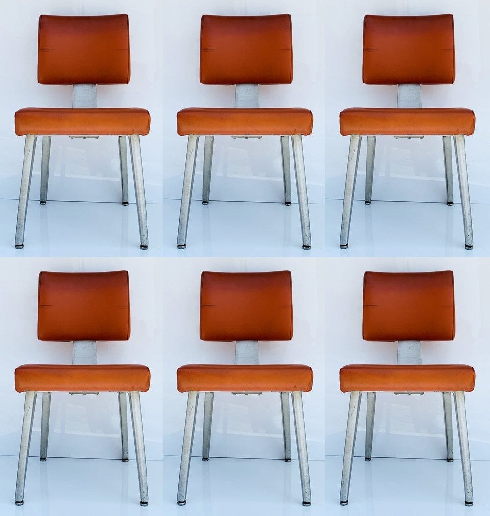 Set of 6 Dining Chairs by GoodForm: Mid 20th century modern General Fireproofing GoodForm aluminum industrial task chairs in original red Naugahyde upholstery.The chairs are in good vintage condition, there are nicks to legs and upholst
