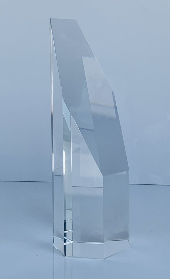 Slant Cut Crystal Tower Obelisk: Crystal Slant Cut Crystal Tower lends a bold and handsome look to any desk or table.Dimensions: 3 inches wide x 3.50 inches deep x 9.75 inches highHandcrafted optical crystalLead Free CrystalSpot Clea