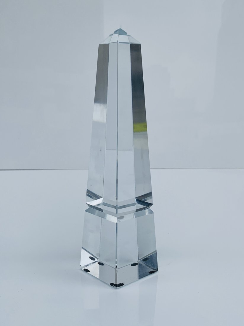 Crystal Glass Obelisk, New in the Box: Beautiful crystal glass obelisk.Measurements:10 inches high x 2.50 inches squareAll items are sold as is. The auction house does not warrant authenticity on any specific piece. THERE ARE NO RETURNS. W