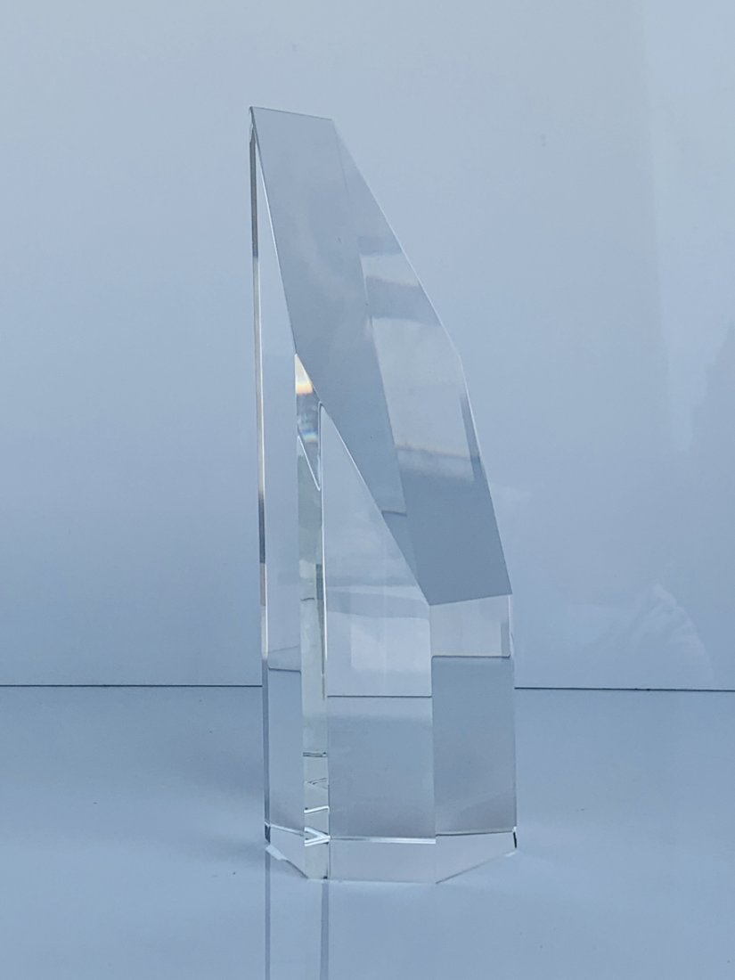 Slanted Crystal Tower Obelisk: Slanted Crystal Tower lends a bold and handsome look to any desk or table.Dimensions: 3 inches wide x 3.50 inches deep x 9.75 inches highHandcrafted optical crystalLead Free CrystalSpot CleanNew in th