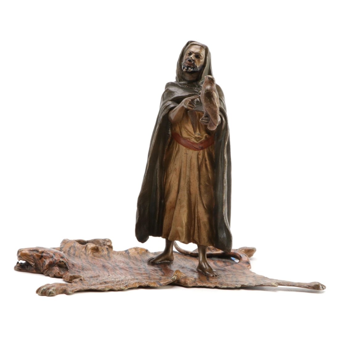 Franz Bergman Falconer on Tiger Rug Austrian Cold Painted Bronze Sculpture: Artist:Franz Bergman Materials:Bronze Marks:Artist Mark Period:Late 19th/ Early 20th Century, Antique Origin:Austria Measurements: 6.25 inches wide x 5 inches high x 4 inches deep. All items are sold 