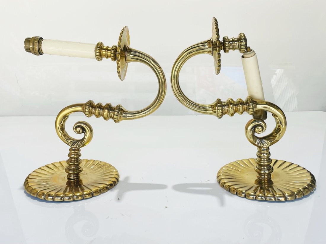 Pair of Solid Brass Wall Sconces: Beautiful pair of solids brass wall sconces, hand made in the USA. Measurements: 11 inches high x 7 inches wide x 11.75 inches projection from the wall (backplate is 7 inches in diameter.) All items a