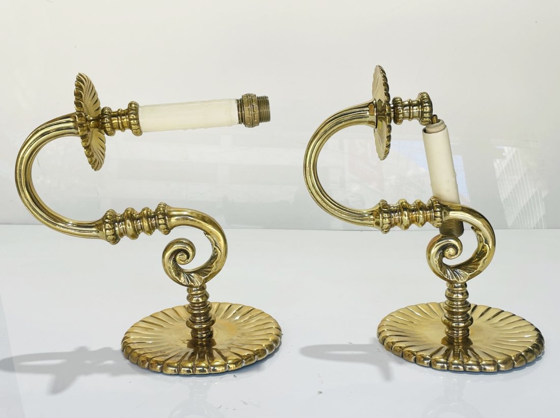Pair of Solid Brass Wall Sconces: Beautiful pair of solids brass wall sconces, hand made in the USA. Measurements: 11 inches high x 7 inches wide x 11.75 inches projection from the wall (backplate is 7 inches in diameter.) All items a