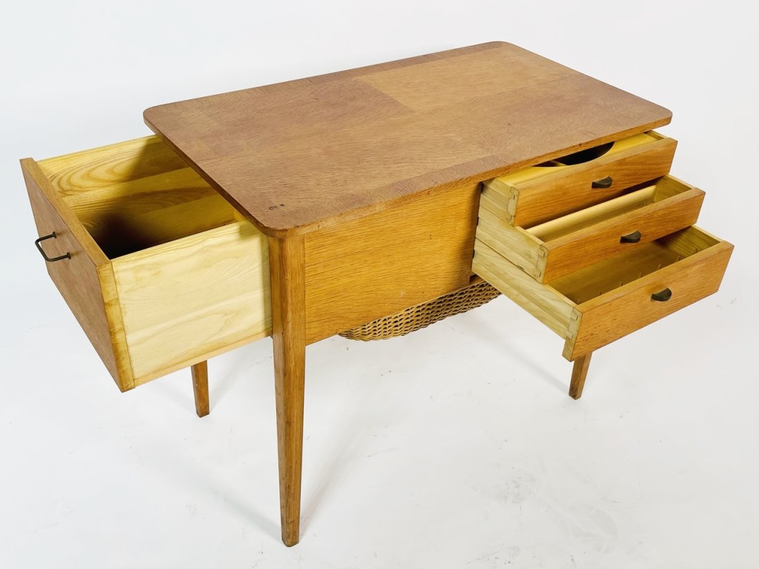 Danish Modern Sewing Cabinet and Table with Basket: Vintage danish modern sewing cabinet with drawers and the original wicker basket.Original from the 1950s, one owner.Measurements:29.25 wide 17 inches deep x 24.50 inches high.All items are sold as is.