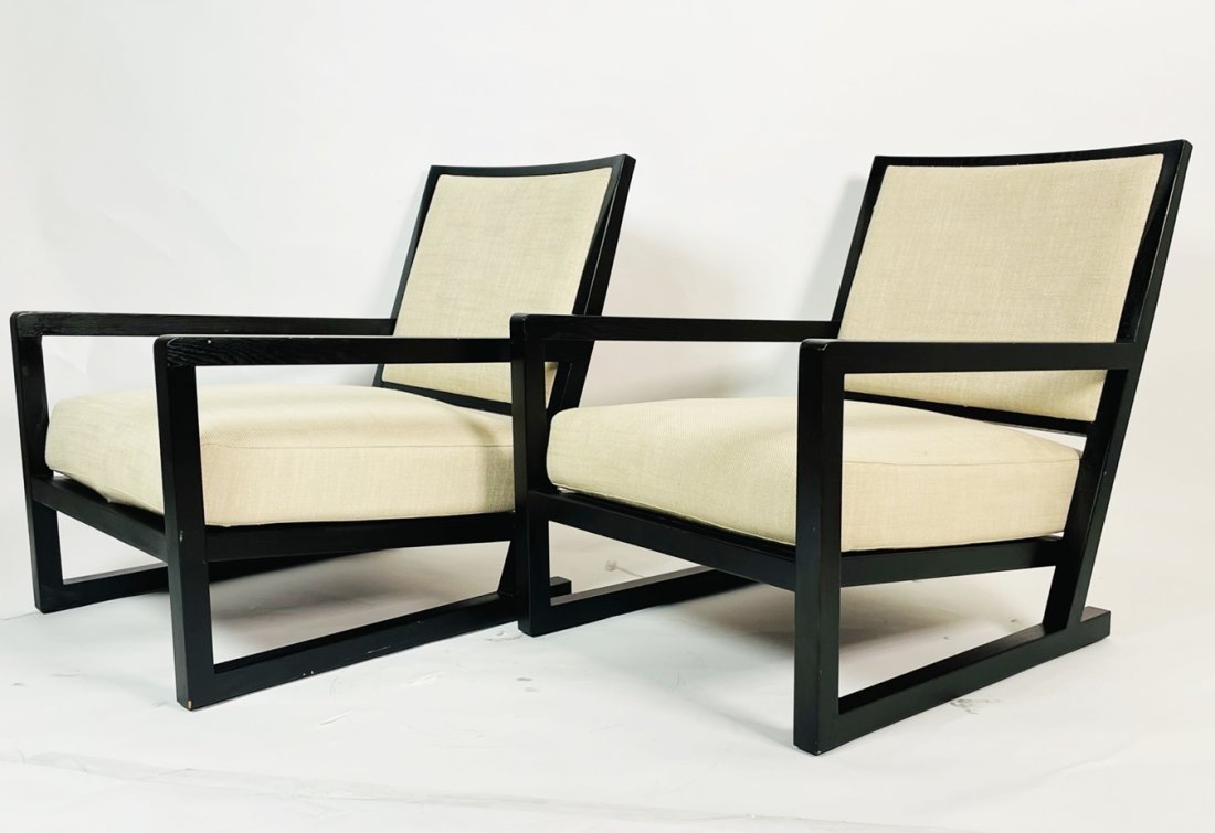 Pair of -SIMON- Lounge Chairs by Camerich: With sweeping curves, the Simon Lounge Chair features a simple, and effortless stance. The solid wood frame supports a down layered seat cushion.The chairs are generous in size and very comfortable.Me