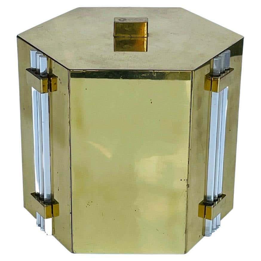 Solid Brass & Lucite Ice Bucket, Tommi Parzinger Style: Beautiful ice bucket made in Italy in solid brass and Lucite accents in the style of Tommi Parzinger. The piece has a hexagonal shape and it presents real well. Measurements: 9 inches wide x 8.50 inch