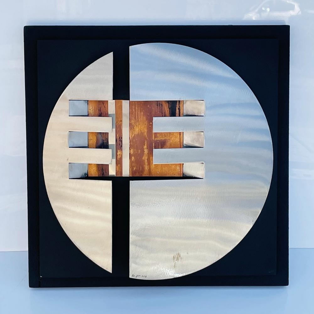 Mixed Metal Wall Sculpture by Curtis Jere: Beautiful sculpture in copper, stainless steel and metal by Curts jere.Good condition.Measurements:18 inches square x 3.50 inches projection from the wall, circle alone is 16 inches in diameter.All it