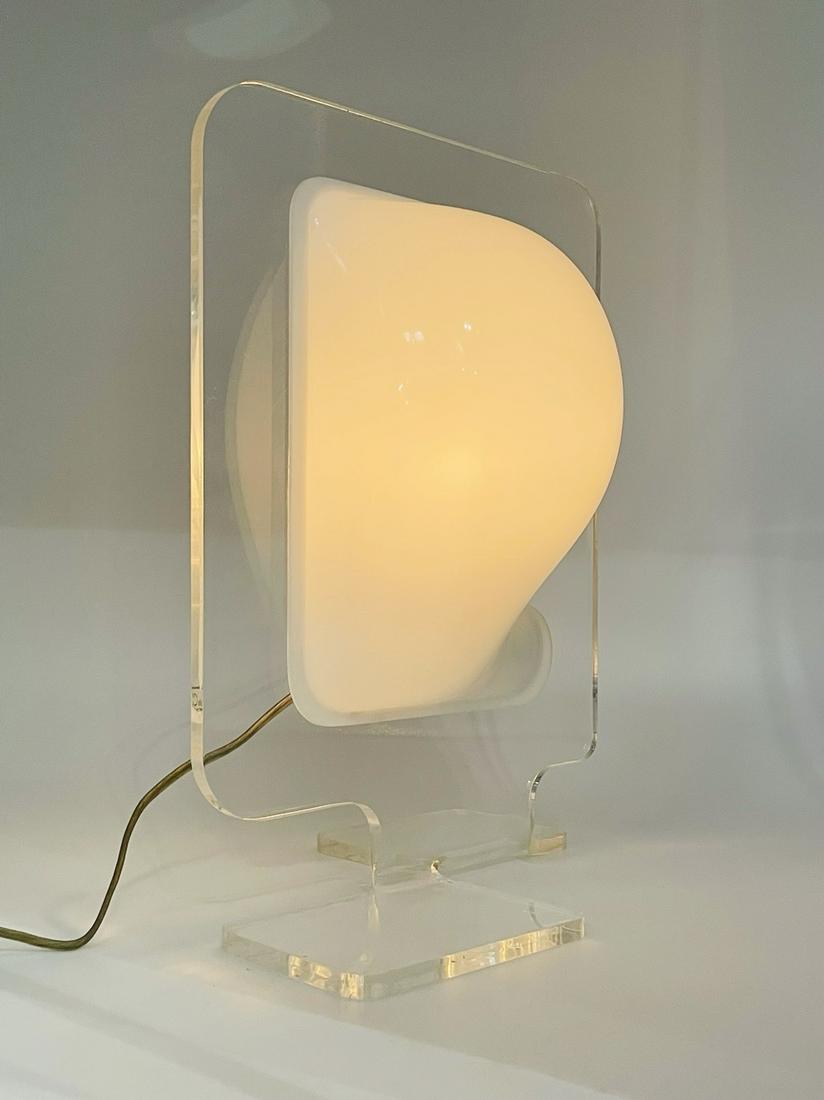 Lucite Table Lamp by Pierre Cardin, Signed: Vintage table lamp designed my Boris Tabacoff for Pierre Cardin.The piece is made out of clear and white Lucite, very whimsical and perfect for any setting.The piece is signed.Measurements:11.25 inche