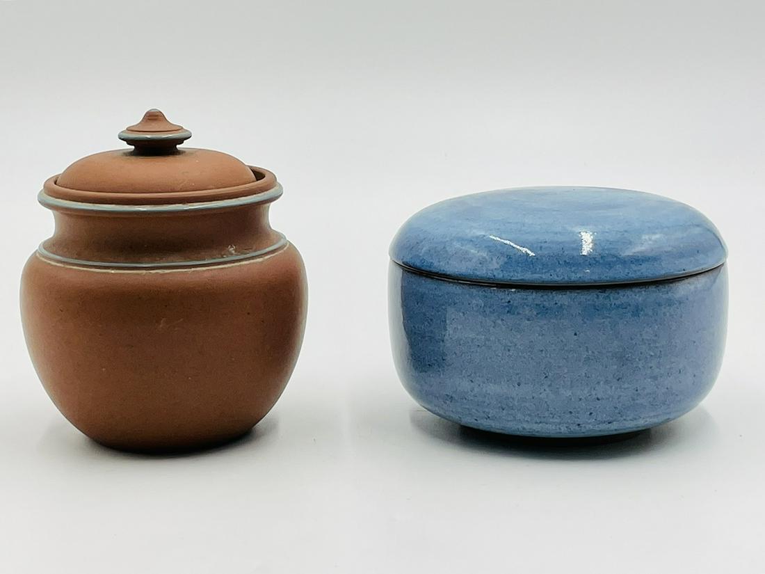 Pair of Lidded Bowls/Pots Including one by Harrison McIntosh (1914-2016): Pair of lidded bowls/pots including one with a blue glaze by Californian potter Harrison McIntosh.The other piece is a lidded clay pot with blue accents, this one is unsigned.Measurements:Harrison McI