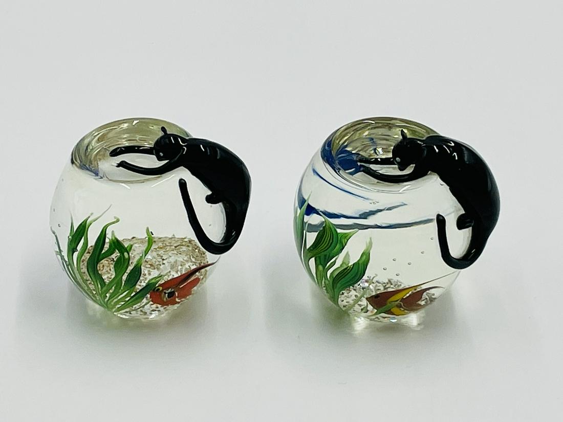 Pair of Paperweights by Correia Art Glass titled -Cat on a Fishbowl-: Pair of Correia Art Glass Cat on a Fishbowl Paperweights Having a black cat poised on the edge of a fishbowl containing a blue and orange angelfish amid green reeds. Signed on underside Correia one da