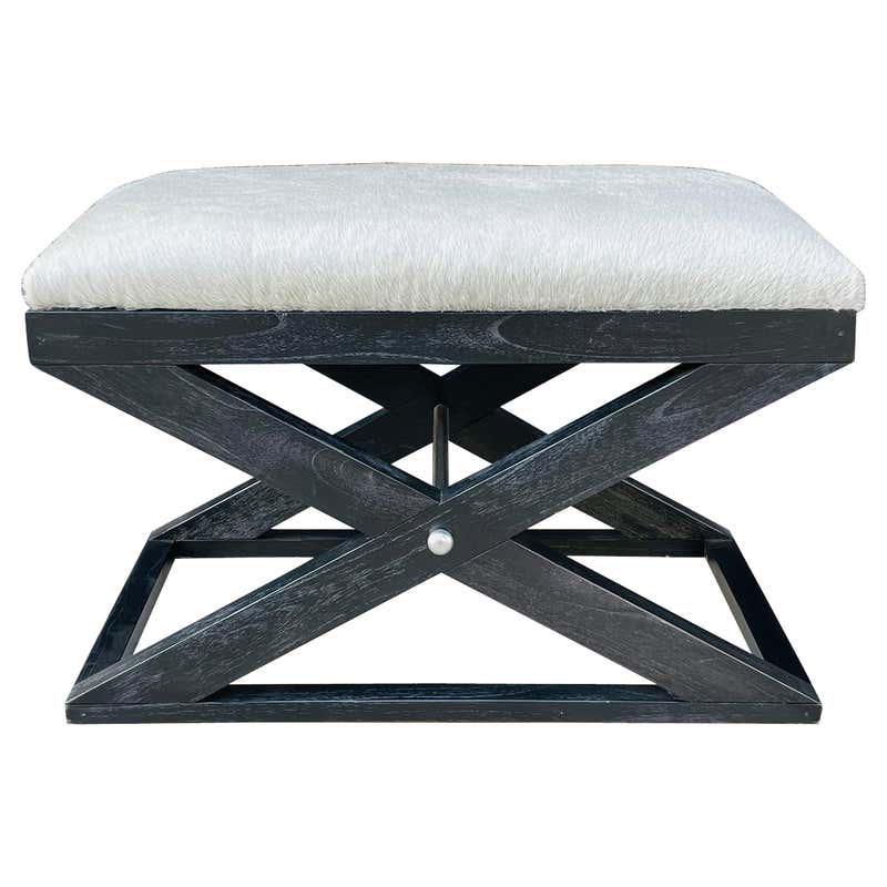 X Frame Bench With Cowhide Upholstery & Stainless Steel: Beautiful X frame bench, the dark wooden frame has a black limed oak finish and stainless steel stretcher. The bench is upholstered in a grayish cowhide upholstery. Measurements: 30 inches wide x 18 i