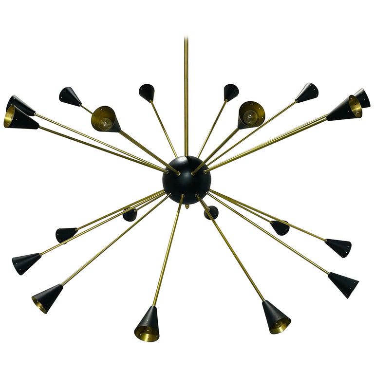 56 inch Diameter Sputnik Style Brass Chandelier: Very large Sputnik style chandelier in solid brass with black finish light shades and center ball. The piece is very beautiful and imposing in person, the arms come off for easy transport/shipping. Me