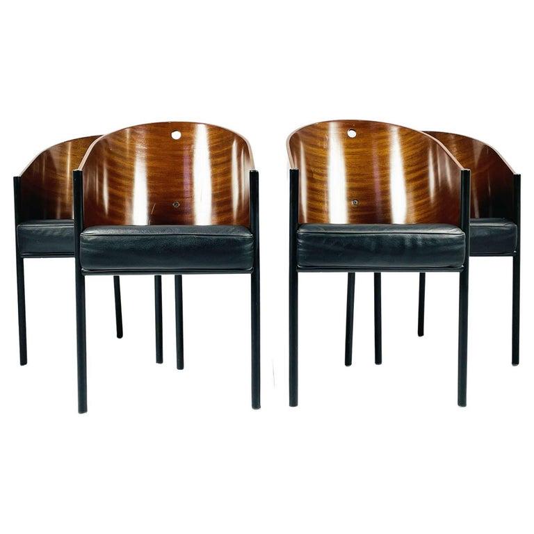 Set of Four Driade Costes Mahogany Chairs by Philippe Stark, Signed: Compact dynamism converges in this stunning armchair by Philippe Starck. Ideally complementing private studies as well as dining rooms with its captivating harmony of sleek lines and intriguing curves