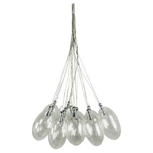 Modern Glass Chandelier: This stunning chandelier is perfect for adding a modern touch to any room. Crafted from clear glass, this light features a sleek design that will make a statement in any home. The clear glass allows