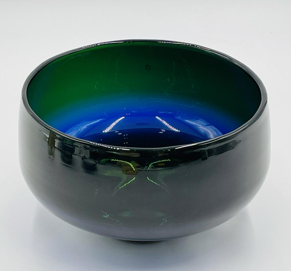Large Art Glass Bowl by Correia Art Glass: Stunning and large art glass bowl by Correia art glass of Santa Monica California.The bowl has bands of different colors which are brighter when light hits them. This bowl is unsigned. Measurements: 9