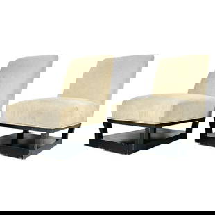 Pair of Slipper Chairs with Magazine/Shoe Shelf by John Hutton for Donghia: Beautiful pair of slipper chairs designed by John Hutton and manufactured in the USA by Donghia. The chairs have beautiful lines, the base has an integrated shelf that can be use as a magazine holder