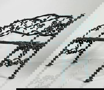 Mid-19th Century English Iron Garden Bench: This fine early bench cast between 1830 and 1850 is in a naturalistic twig form covered sparingly with leaves. The bench is a very heavy casting and while simple looking is very detailed and well-conc