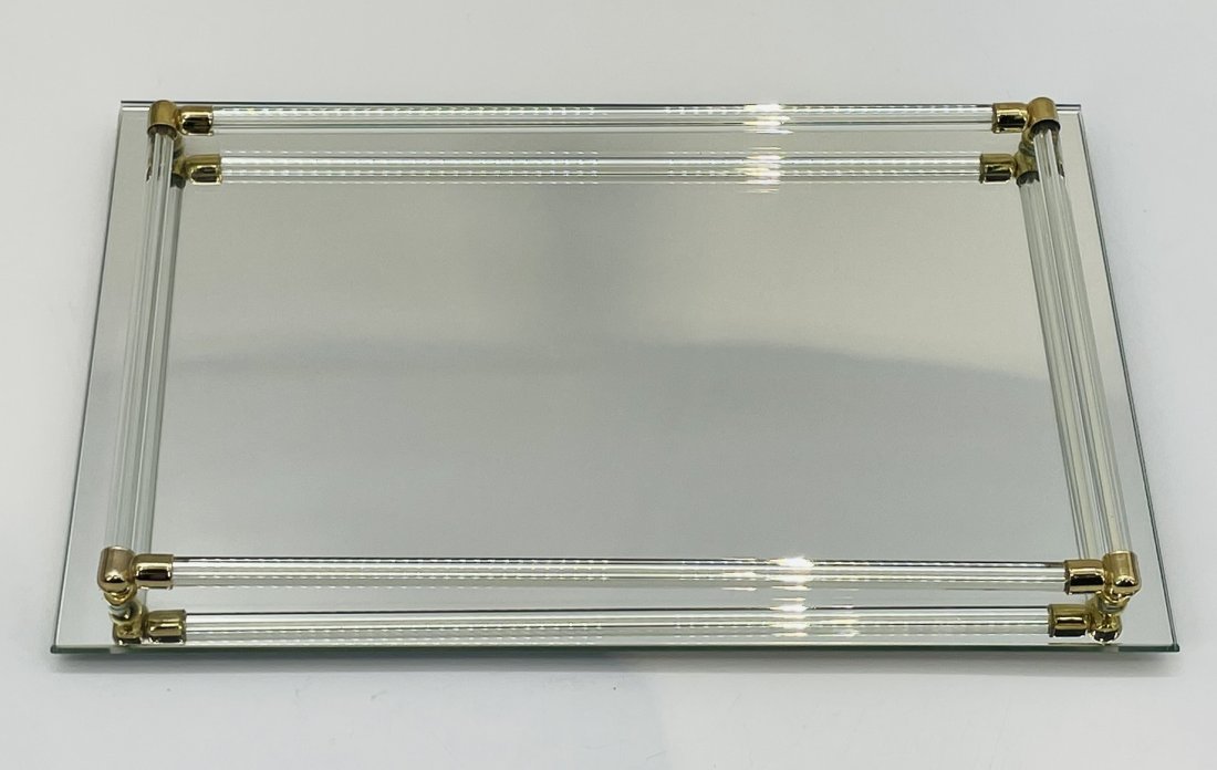 Vintage Mirrored Tray With Brass Accents.: Vintage mirrored tray with brass accents. Measurements: 1.25 inches high x 14 inches wide x 9 inches deep All items are sold as is. The auction house does not warrant authenticity on any specific piec