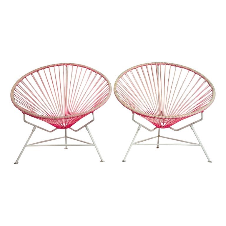 Pair of Acapulco Chairs by Innit Designs: The Innit Designs Acapulco Chair is cool in more ways than one. Based on the original 1950s design, it has an open and airy yet ergonomic and supportive open weave vinyl seat inspired by traditional M