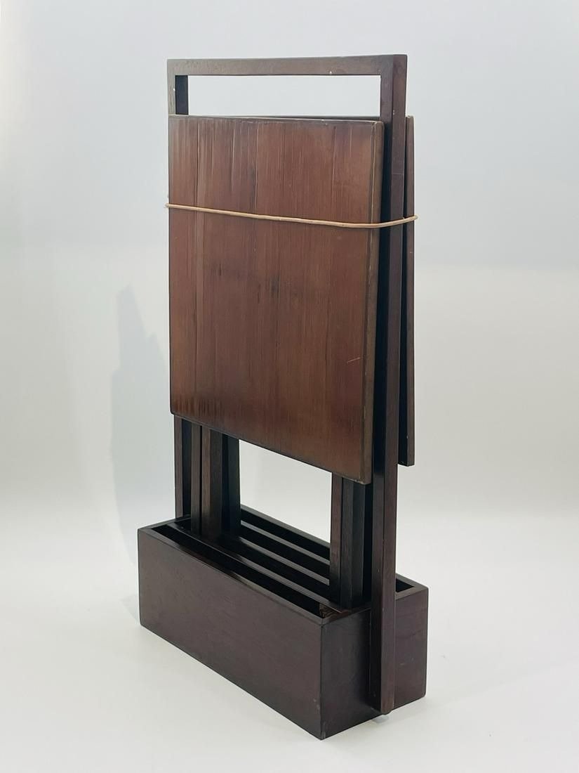 Set of Serving Trays and Stand by Armani Casa: Tray tables and table stand/holder designed and manufactured by Armani Casa. Retains the original label. Measurements: 30.25 inches high x 17.50 inches Wide x 6.75 deep Tray standing. 15.75 inches squ