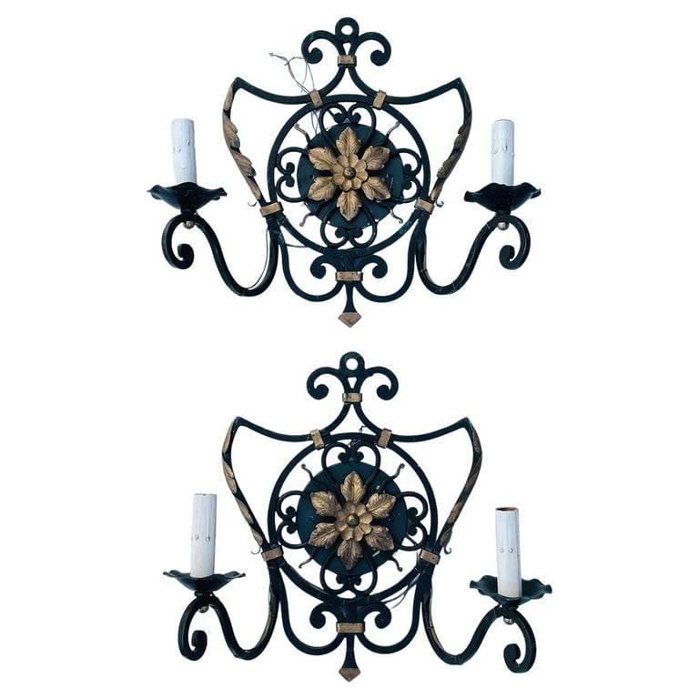 Pair Of Italian Wall Sconces With Metal Gilt Accents: Nice pair of Italian made wall sconces, black metal with gold gilt accents.Solid brass wall plates. Measurements: All items are sold as is. The auction house does not warrant authenticity on any speci