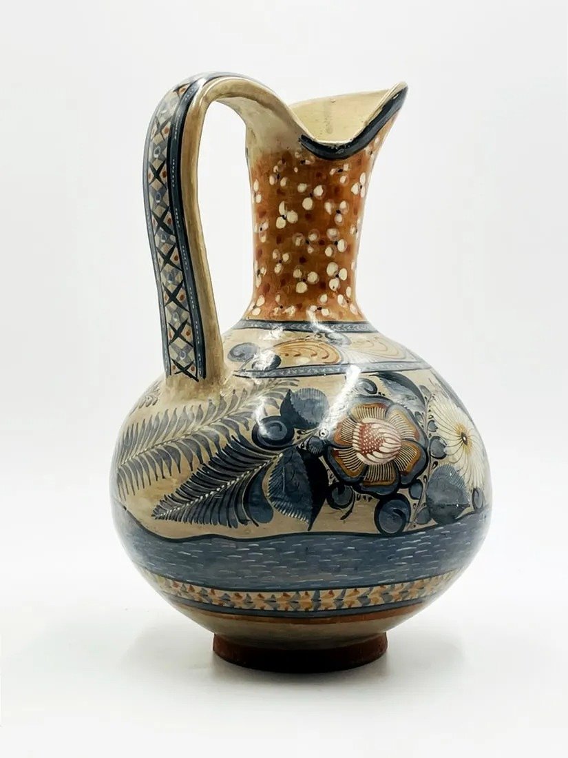 Tonala Style Water Pitcher, Hand-Painted: Beautiful Tonala style hand painted water pitcher, the pitcher has a wonderful hand painted foliage and flowers. Measurements: 13 inches high x 9 inches in diameter at widest. All items are sold as is