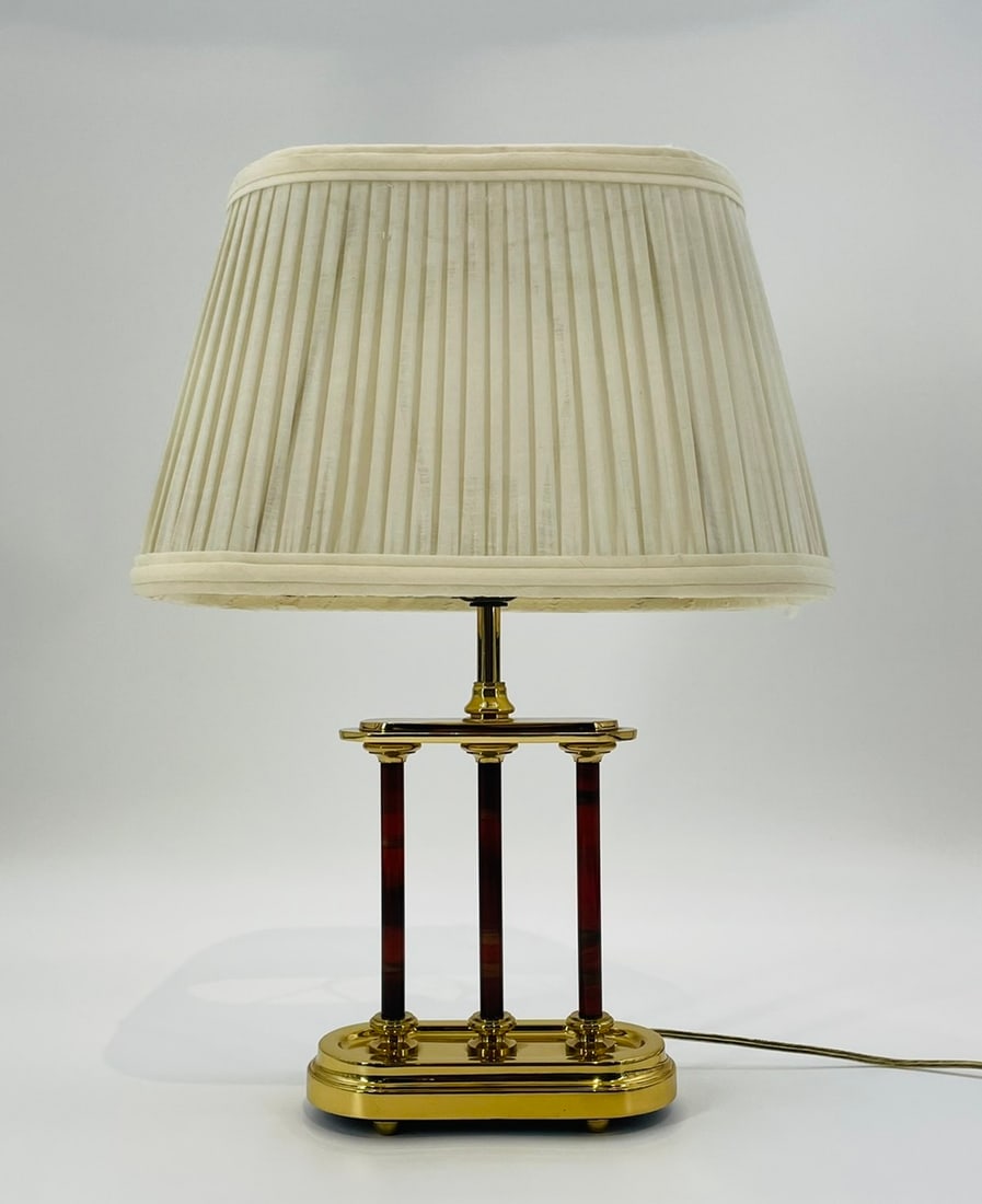 Vintage Brass Lamp Made in the USA by Frederick Cooper, 1970s: Vintage table lamp designed and manufactured in the USA by Frederick Cooper, Chicago Illinois. The lamp has a brass body with a cream colored shade. Measurements: 18.50 inches high x 13 inches wide