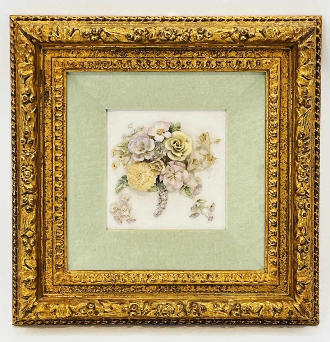 Framed Capodimonte Ceramic Flowers: Capodimonte Ceramic Flowers composition framed on a gold gilded frame. Measurements: 17 inches high x 17 inches deep x 2.75 inches deep/projection from the wall. All items are sold as is. The auction 