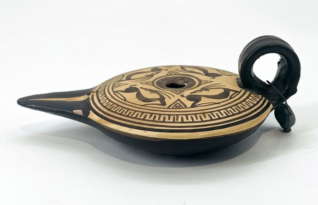 Vintage Oil Lamp Replica of an Ancient Greek Design.: Vintage oil lamp replica of an ancient Greek design. Signed. Measurements: 5.50 inches wide x 3.75 inches deep x 2 inches high. All items are sold as is. The auction house does not warrant authenticit