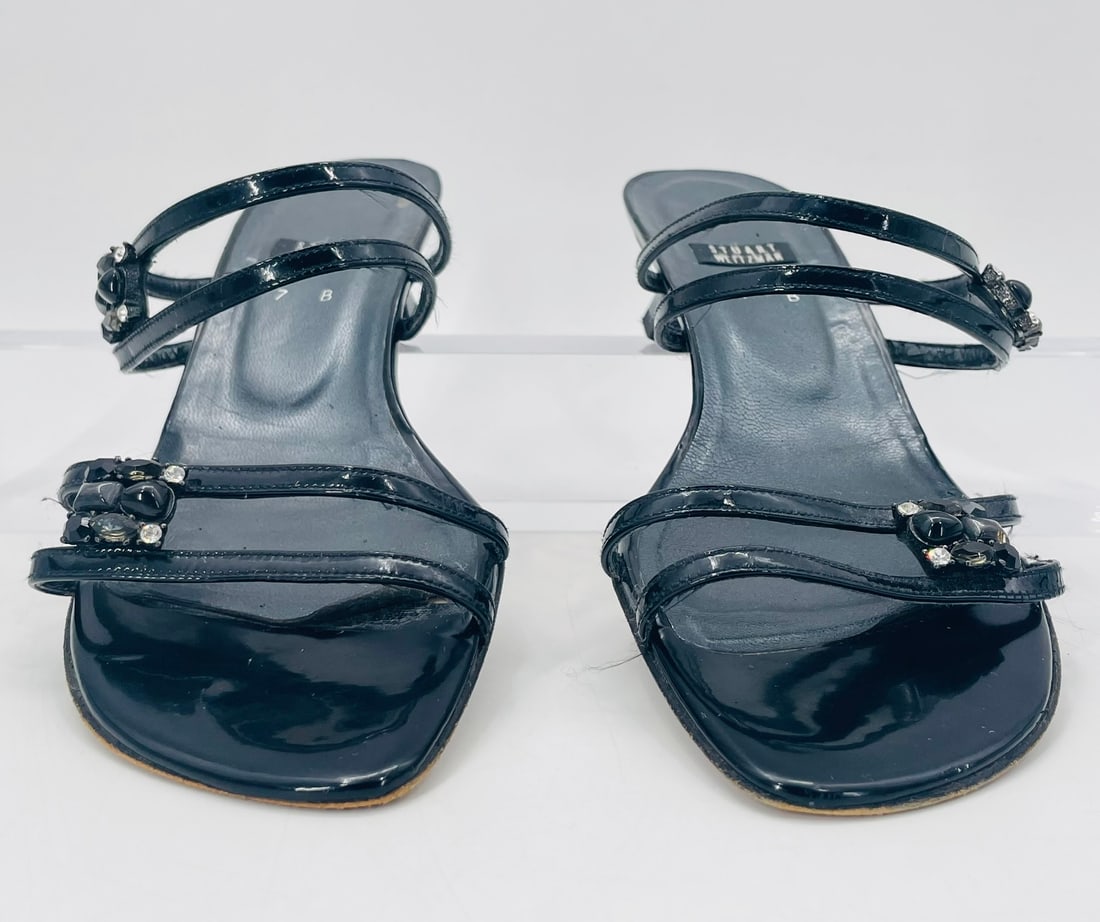 Black Leather Low Heel Sandals Size 7 B, Made in Italy by Stuart Weitzman: Black Leather Low Heel Sandals size 7 B, Made in Italy by Stuart Weitzman. Measurements: 3.5 inches x 3.5 inches x 9.5 inches in length. All items are sold as is. The auction house does not warrant au