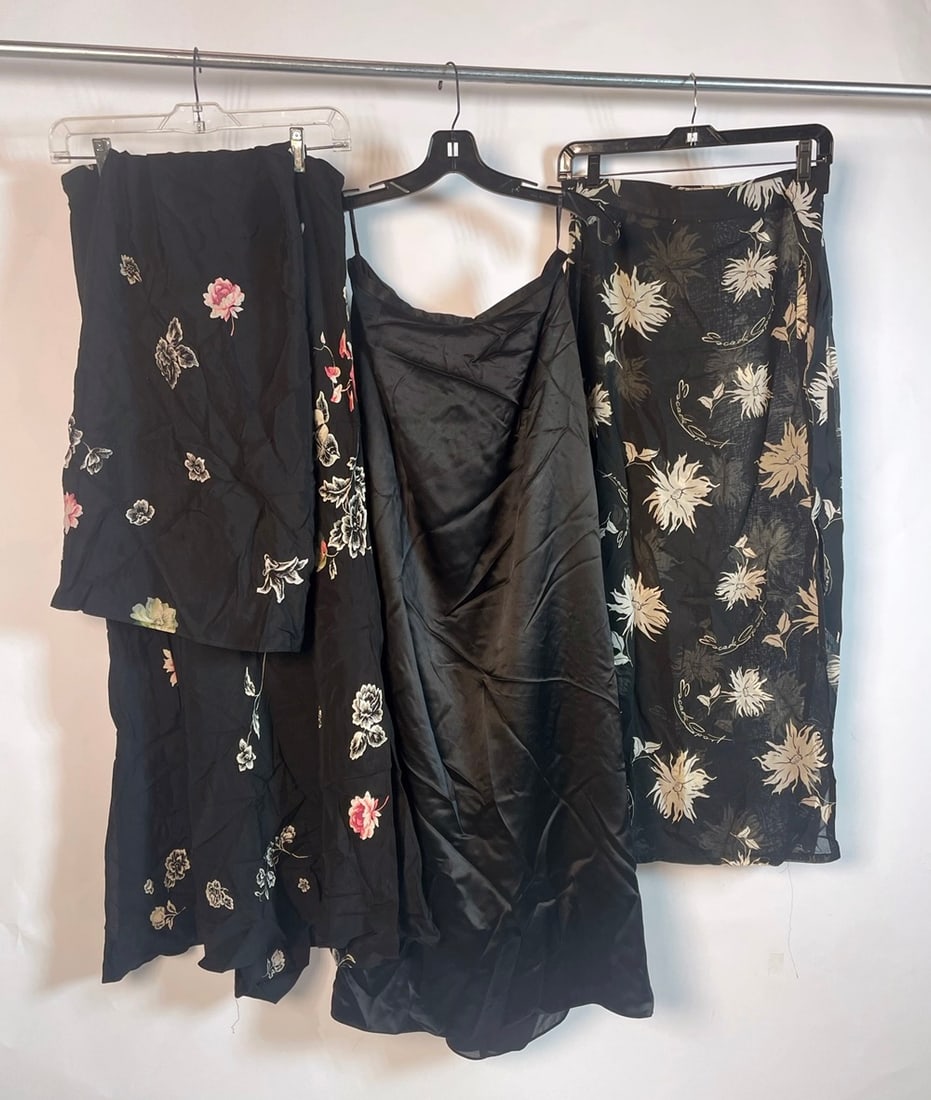 Trio of Long Skirts by Von Saken, Escada, and Kay Unger: Trio of Long Skirts by Von Saken, Escada, and Kay Unger. From left to right of lineup: Von Saken black skirt with flowers with extra cloth to go over bathing suit, made in USA from 100% Rayon - size
