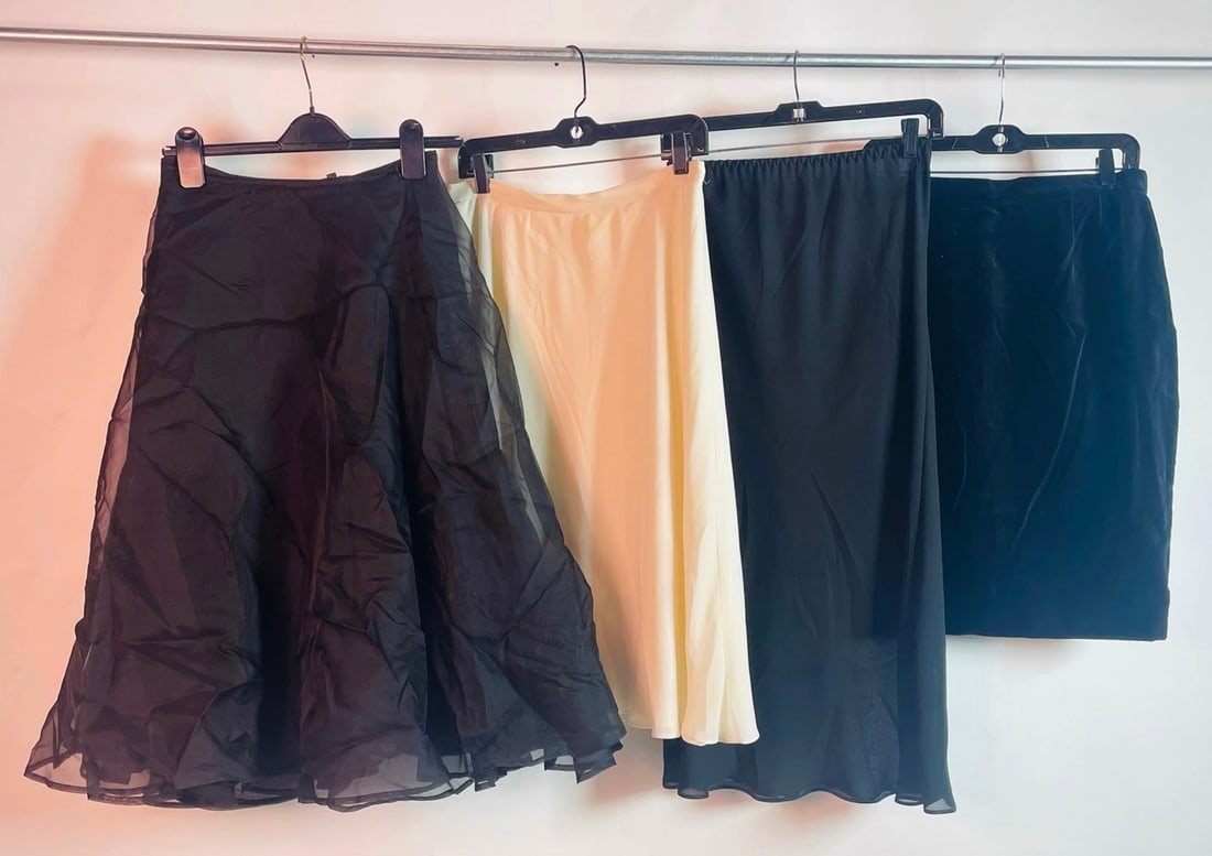 Set of 4 Skirts by Chine, Escada, Flora Nikrooz, & Farr West: Set of 4 Skirts by Chine, Escada, Flora Nikrooz, & Farr West. From left to right of lineup: Chine black flaired skirt - size 1, 13 inches at waist x 29.25 total length Flora Nikrooz cream skirt, made