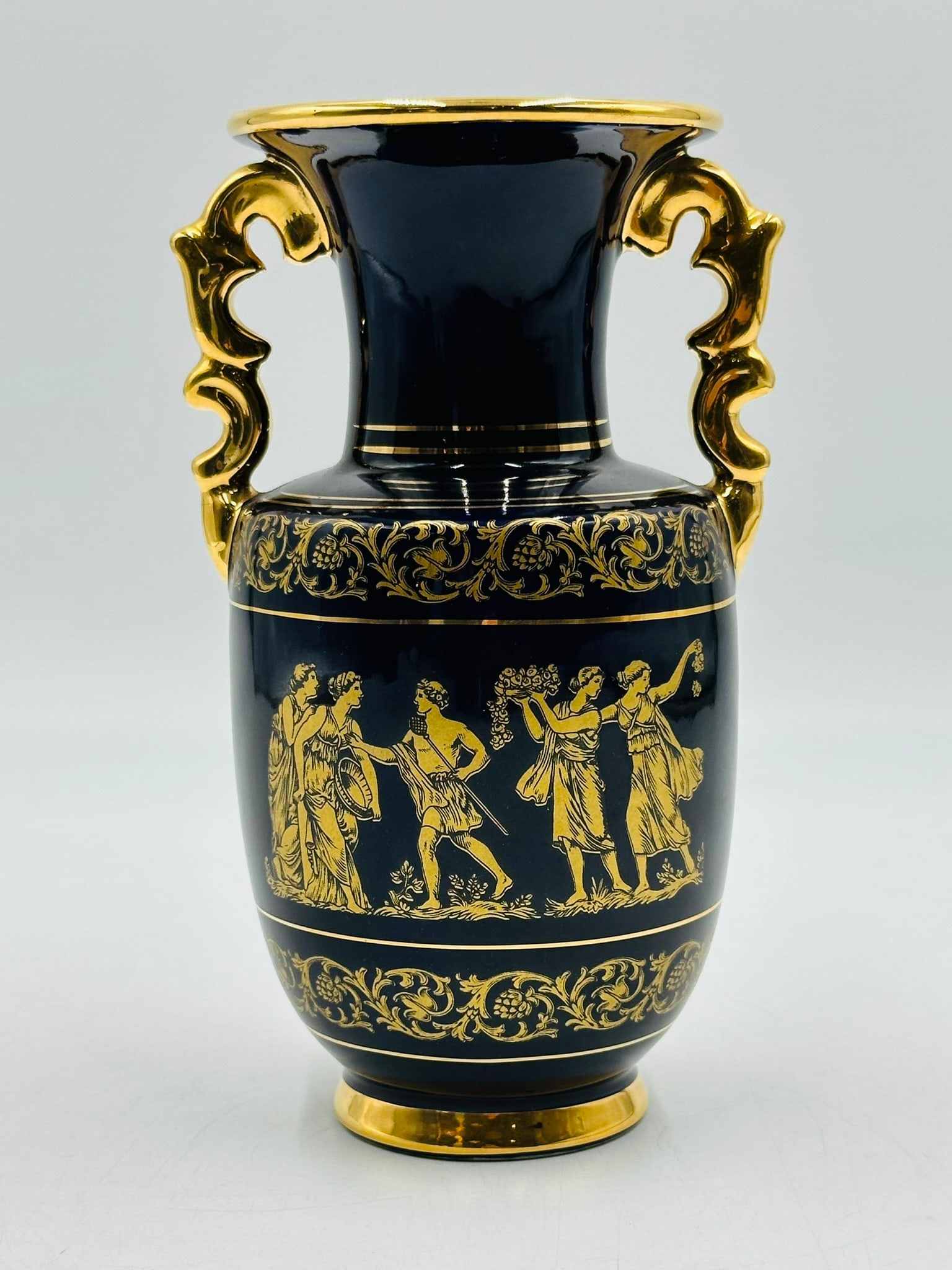24K Gold and Cobalt Blue Porcelain Vase made in Greece, Circa 1970s: 24K gold and cobalt blue porcelain vase made in Greece possibly in the early to mid 1970s. The colors are very rich and vibrant; both the dark cobalt blue and the 24K gold which shimmers beautifully. 