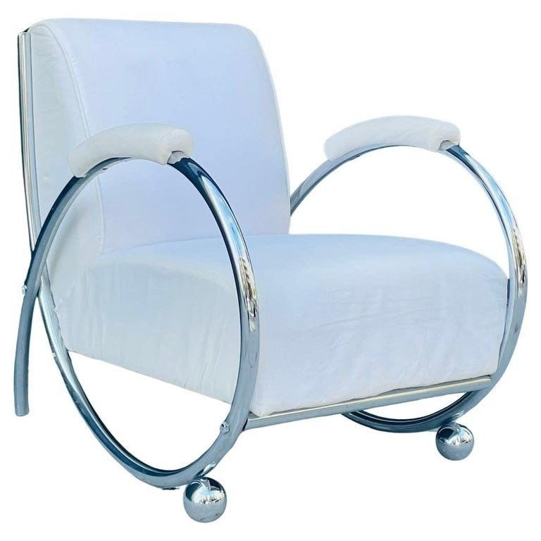 Armchair -Saxhorn- by CLC France, France 1940's: Vintage Saxhorn armchairs by CLC, France 1940s. The chair is upholstered in a white fabric with a tubular chromed frame. No labels. Measurements: 32 inches high x 26.50 inches wide x 33.75 inches deep