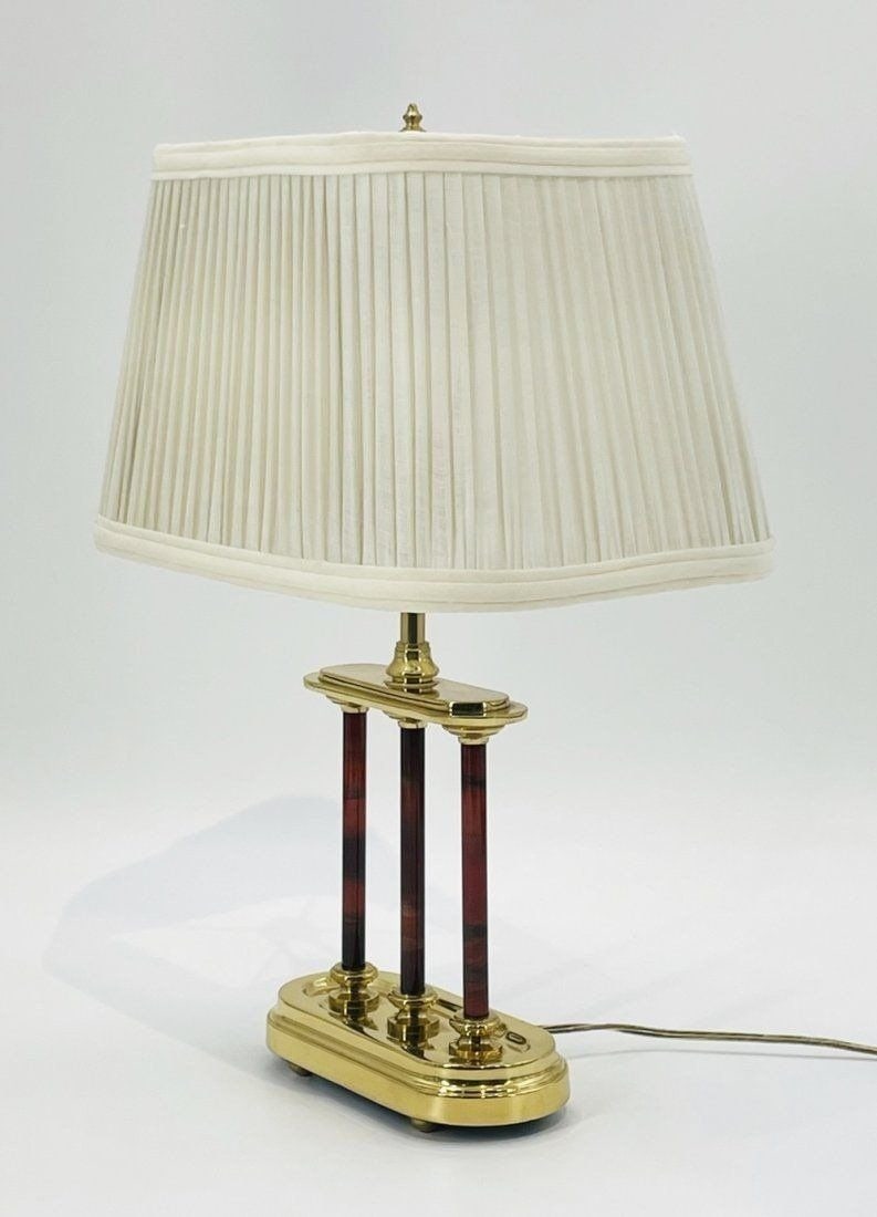 Vintage Brass Lamp Made in the USA by Frederick Cooper, 1970s: Vintage table lamp designed and manufactured in the USA by Frederick Cooper, Chicago Illinois. The lamp has a brass body with a cream colored shade. Measurements: 18.50 inches high x 13 inches wide x
