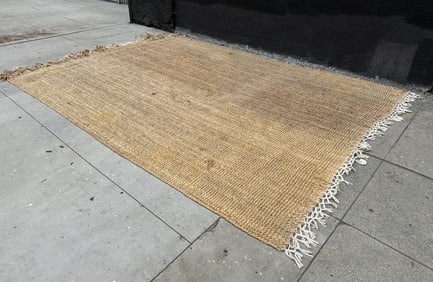 Large Jute Rug in used condition.   Measurements:  144 inches wide x 103 inches deep.   All items