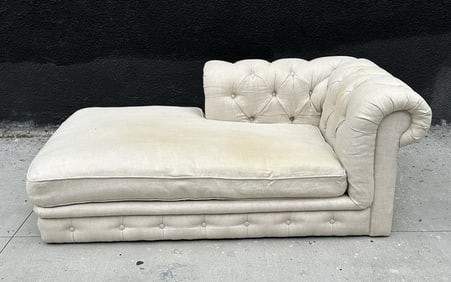 Restoration hardware lounge chair with tufted backrest.   The piece is upholstered in a linen