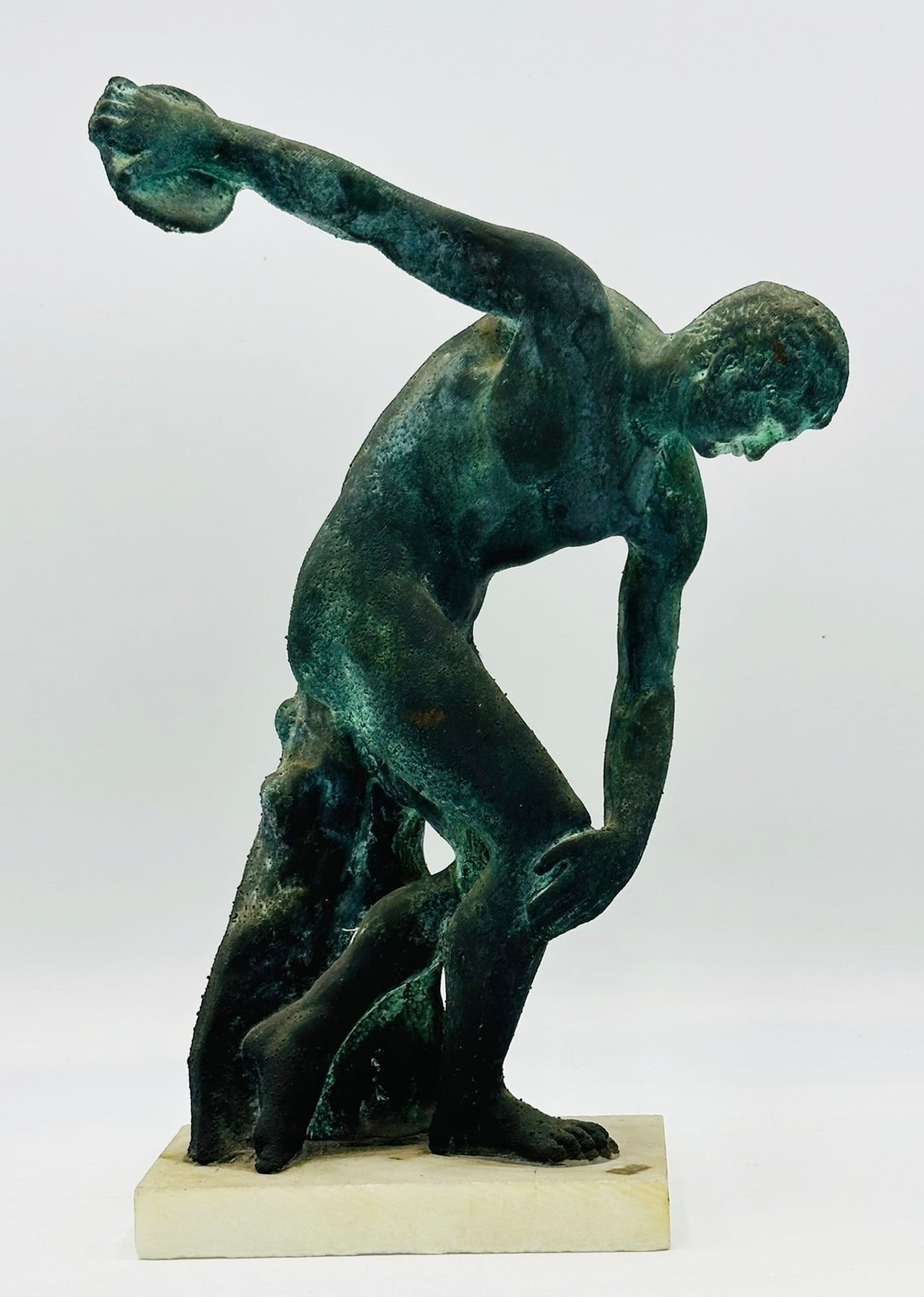 -The Diskobolos- Sculpture in the Manner of Myron.: This discus thrower mimics the later Roman reproductions of the Greek sculptor, Myron. Unmarked. Measurements: 13.25 inches high x 8.50 inches wide x 3.25 inches deep. All items are sold as is. The au