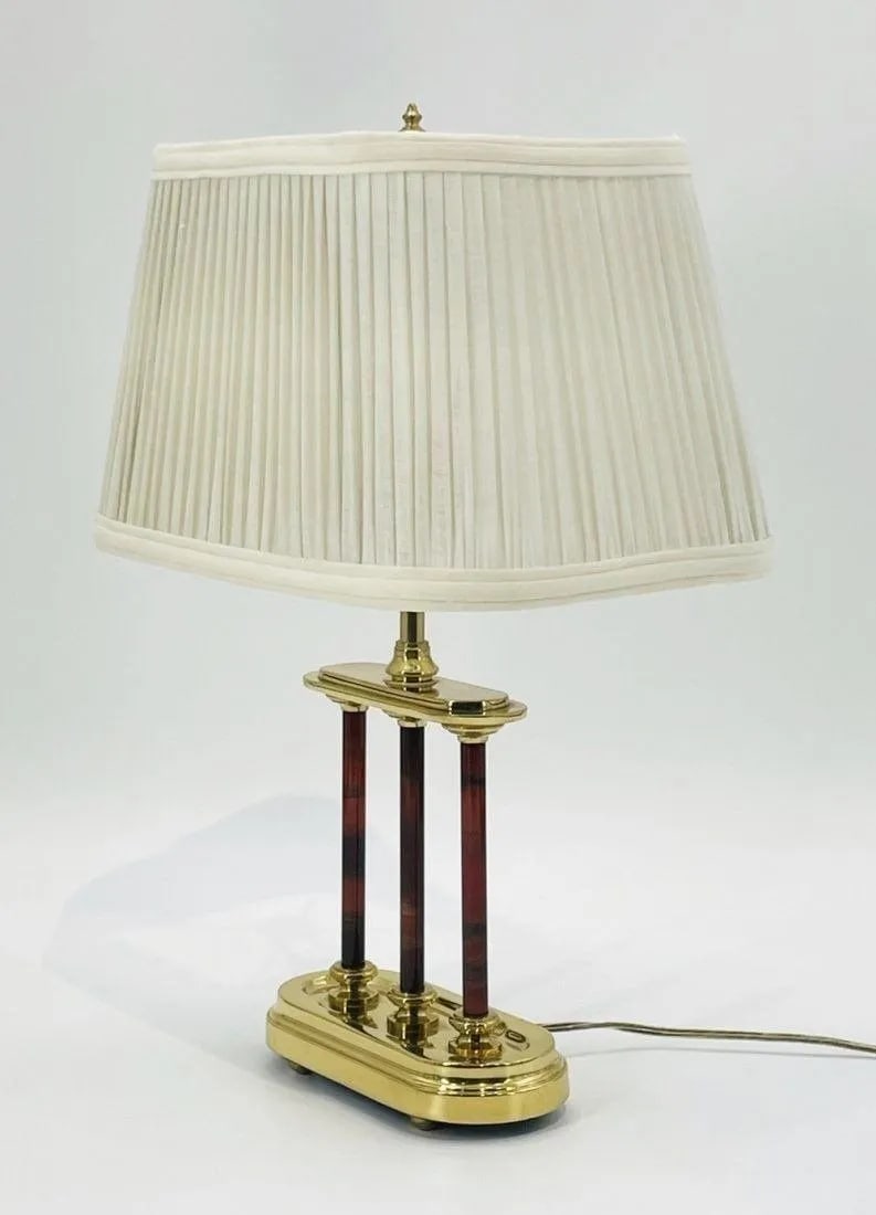 Vintage Brass Lamp Made in the USA by Frederick Cooper, 1970s: Vintage table lamp designed and manufactured in the USA by Frederick Cooper, Chicago Illinois. The lamp has a brass body with a cream colored shade. Measurements: 18.50 inches high x 13 inches wide x