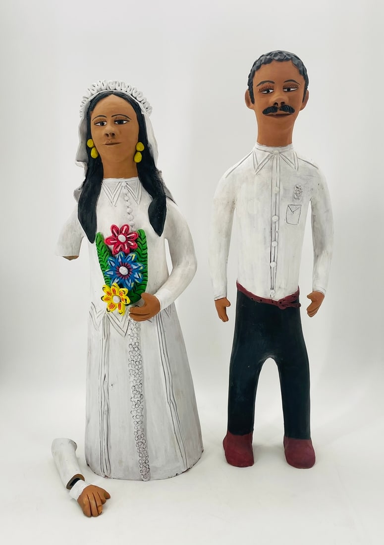 Groom & Bride Barro Sculpture by Josefina Aguilar (Mexico 1945): Vintage groom and bride barro sculptures made in Mexico in the 1980s by Josefina Aguilar (Mexico 1945) The sculptures have great attention to detail, beautiful colors and are well made. The bride need