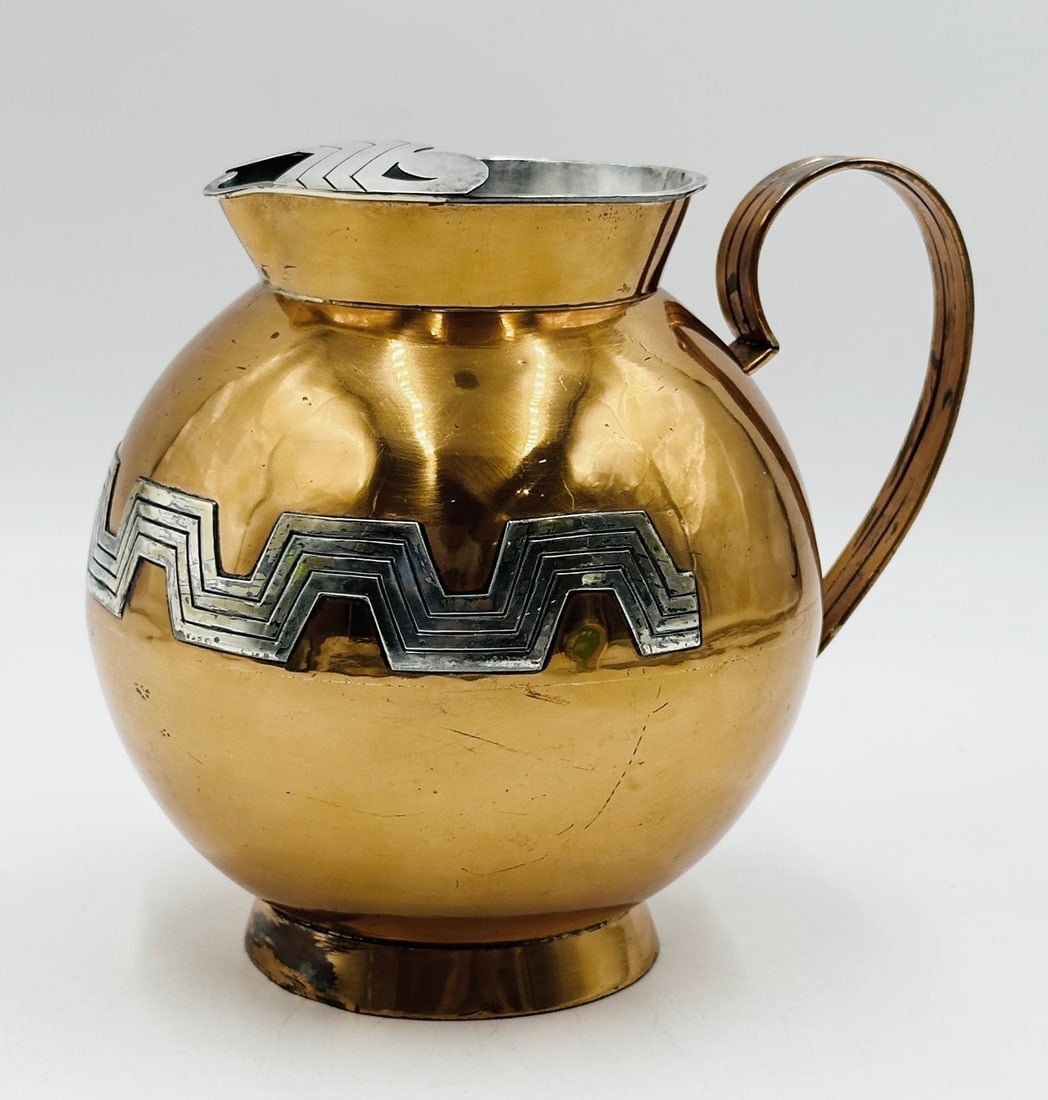 Copper & Silver Water Pitcher by Ana Nunez de Brilanti for Victoria, Taxco Mexico: Beautiful water pitcher in copper and silver, designed and manufactured in Taxco, Mexico by Ana Nunez de Brilanti for Victoria of Taxco. The design on the picture reflects the Mexican Aztec and Mayan