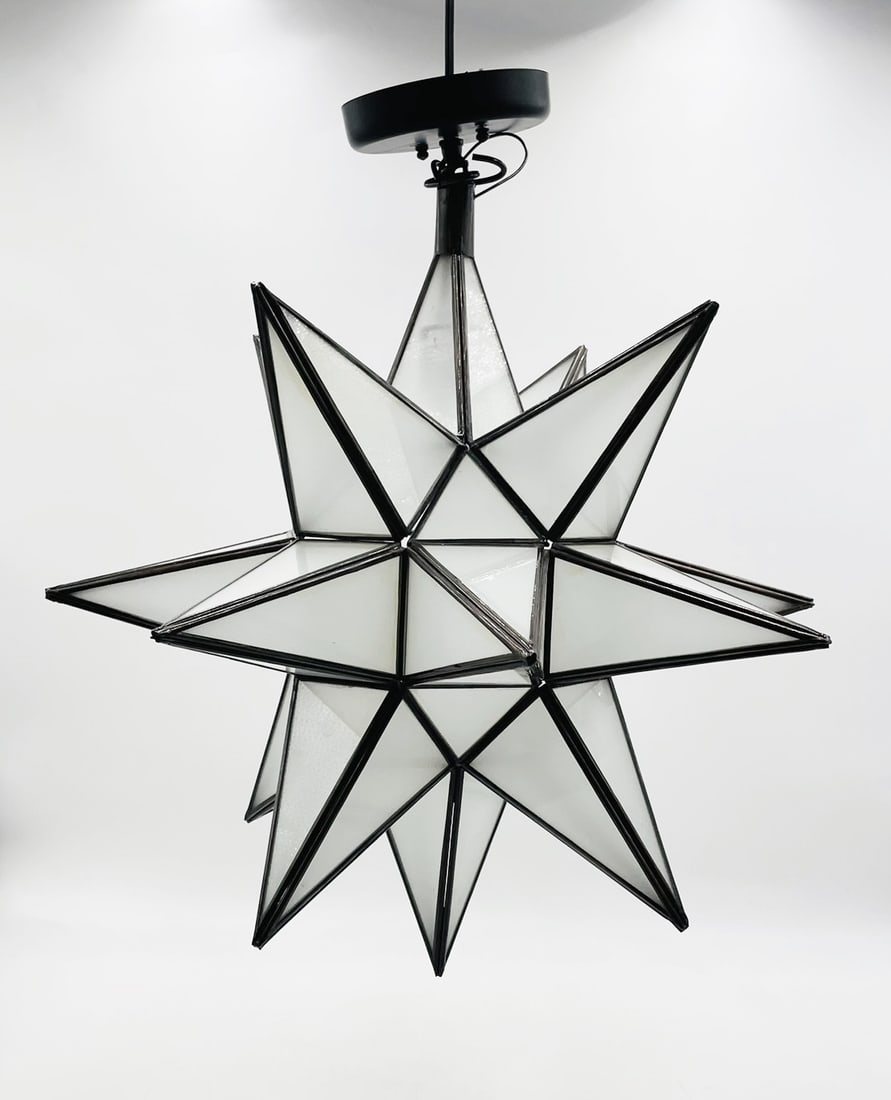 Glass & Metal Star Shaped Chandelier: Glass and metal star shaped chandelier. Measurements: 28 inches high x 18 inches wide x 18 inches deep. Unsigned. All items are sold as is. The auction house does not warrant authenticity on any speci