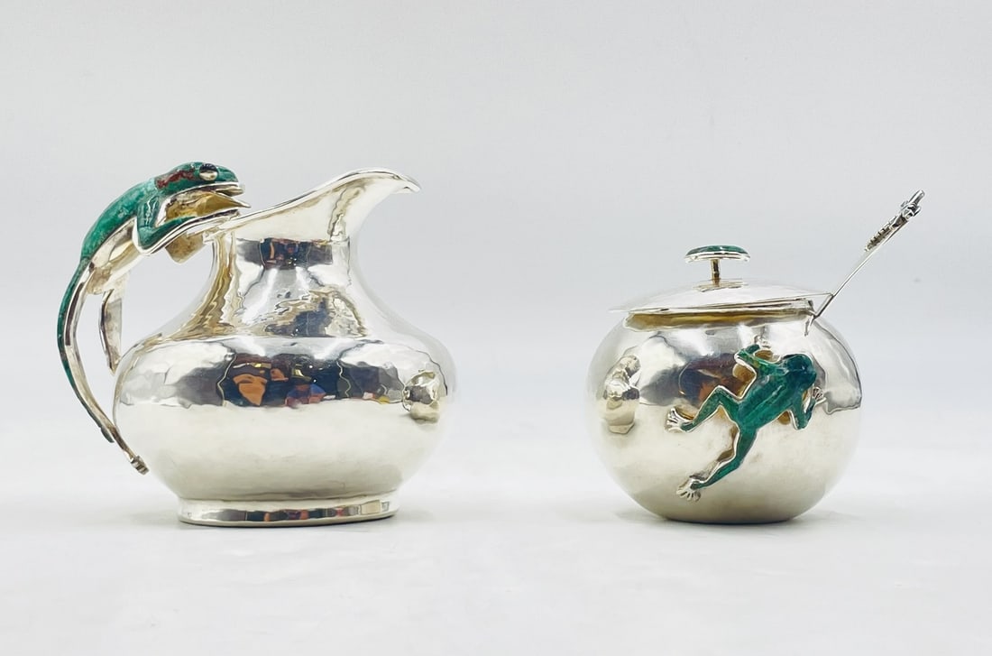 Whimsical Creamer & Sugar Pot with Spoon & Lid by Emilia Castillo, Frog Collection: Whimsical set of creamer and lidded sugar pot and spoon designed and manufactured by Emilia Castillo in Taxco, Guerrero, Mexico. The pieces are from the "Frog" Collection, the feature a frog leaping,