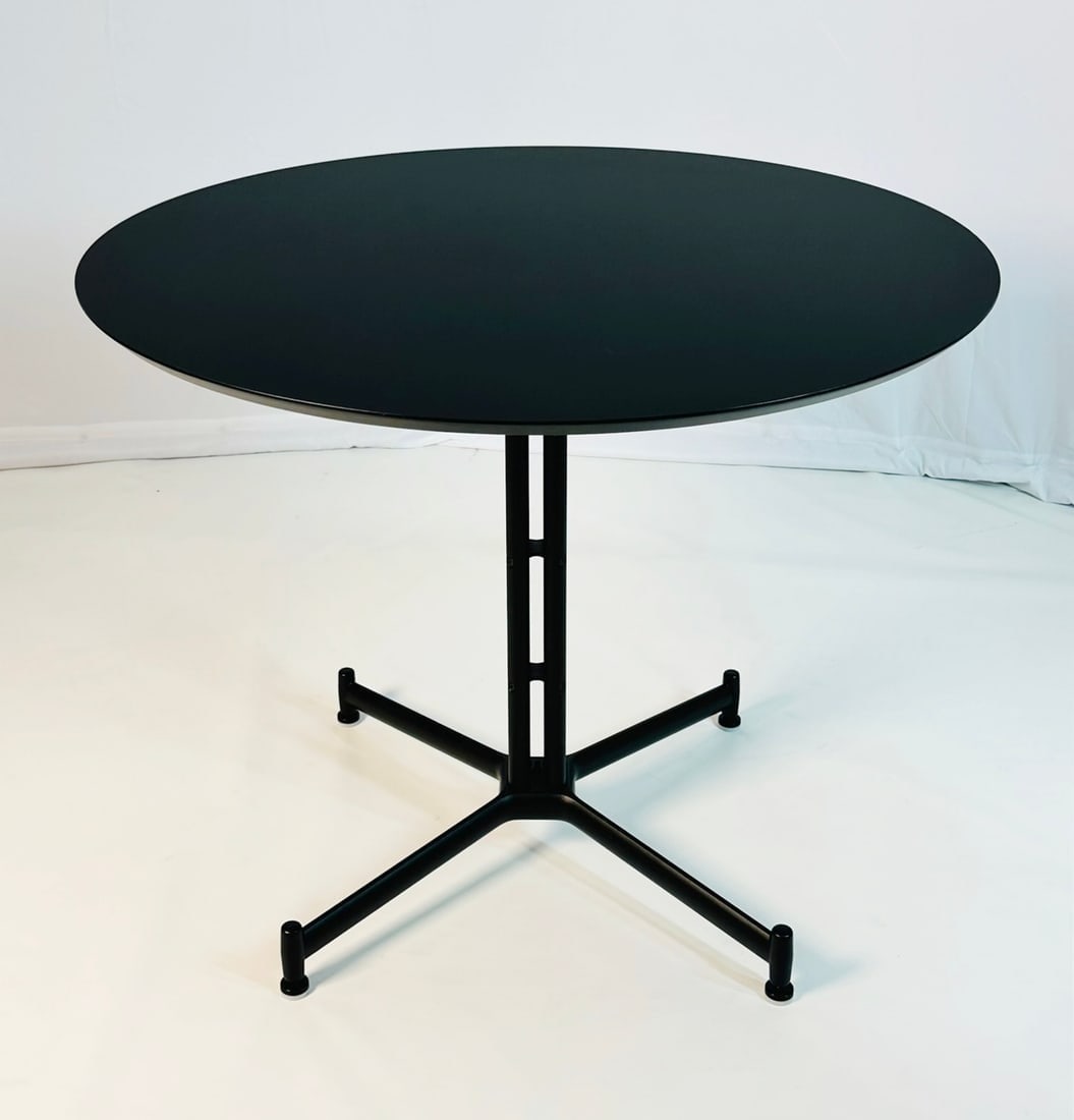 Iquo Bistro Table by Ini Archibong for Knoll, Signed & Dated: The Iquo bistro table features an elegant pedestal base, made of four vertical tubes that provides wire management for power use and is intentionally flat where it meets the floor for comfortably rest
